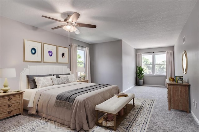 12321 W 105th Ter, Overland Park, KS 66215 - bedroom with light carpet, multiple windows, a textured ceiling, and ceiling fan