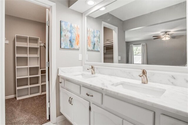 12321 W 105th Ter, Overland Park, KS 66215 - full bath with double vanity, a spacious closet, and ceiling fan