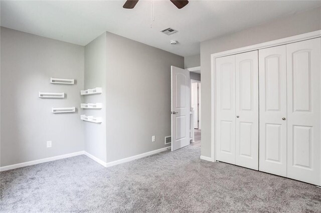 12321 W 105th Ter, Overland Park, KS 66215 - unfurnished bedroom with carpet floors, a closet, and a ceiling fan