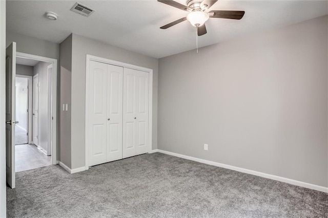 12321 W 105th Ter, Overland Park, KS 66215 - unfurnished bedroom with carpet, a closet, and a ceiling fan