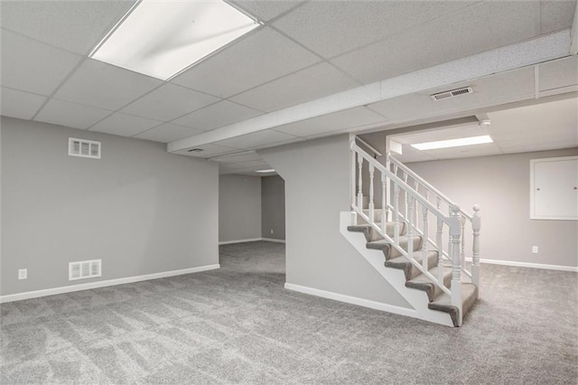 12321 W 105th Ter, Overland Park, KS 66215 - finished below grade area featuring carpet floors, a paneled ceiling, and stairway