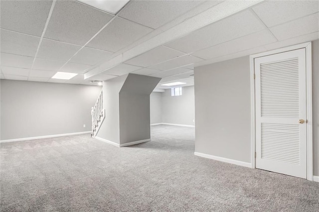 12321 W 105th Ter, Overland Park, KS 66215 - finished basement with carpet floors, a paneled ceiling, and stairs