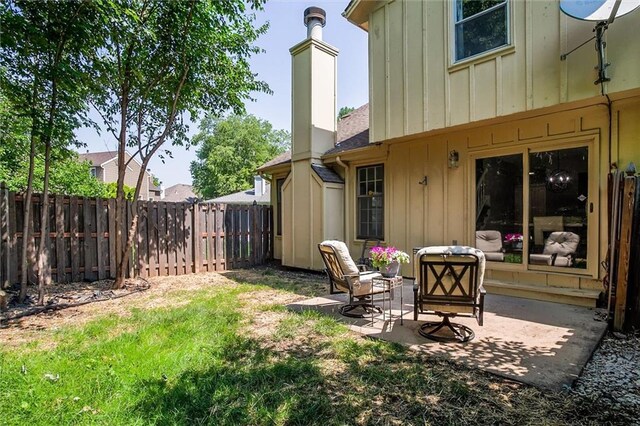 12321 W 105th Ter, Overland Park, KS 66215 - fenced backyard with a patio