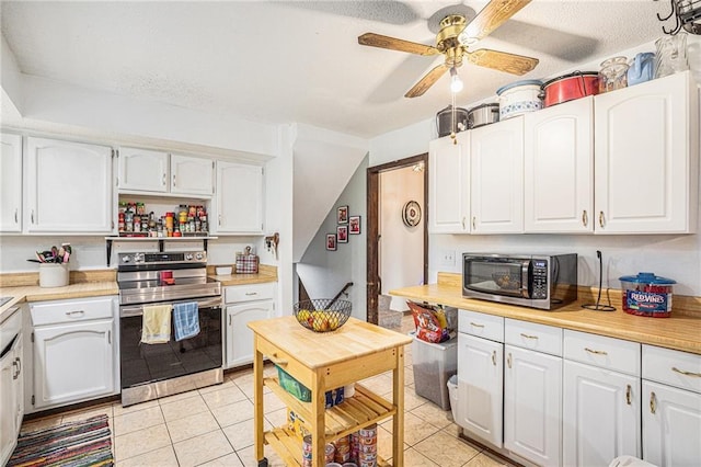 1422 S Kiowa Dr, Olathe, KS 66062 - kitchen featuring stainless steel electric range oven, white cabinets, ceiling fan, light tile patterned floors, and a textured ceiling