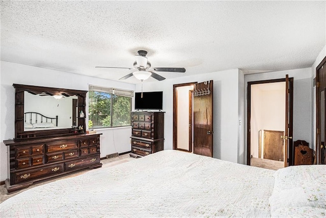 1422 S Kiowa Dr, Olathe, KS 66062 - bedroom featuring a textured ceiling and a ceiling fan