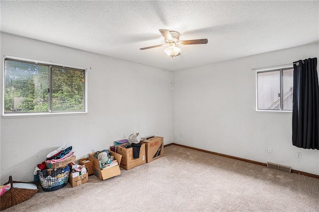 1422 S Kiowa Dr, Olathe, KS 66062 - carpeted spare room featuring a ceiling fan and a textured ceiling