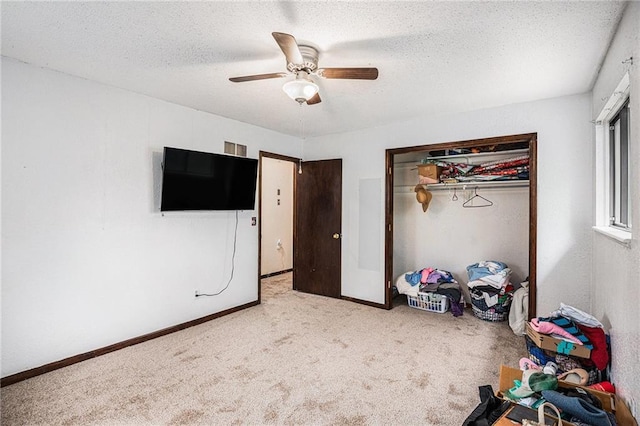 1422 S Kiowa Dr, Olathe, KS 66062 - unfurnished bedroom featuring carpet, a textured ceiling, a closet, and ceiling fan