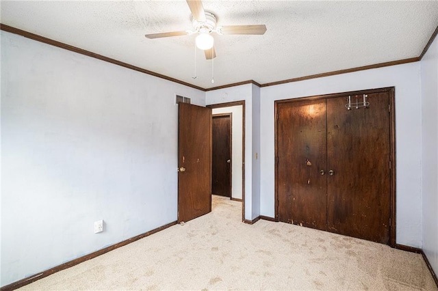 1422 S Kiowa Dr, Olathe, KS 66062 - unfurnished bedroom with carpet flooring, a closet, a textured ceiling, a ceiling fan, and crown molding