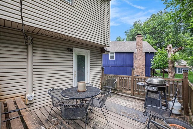 1422 S Kiowa Dr, Olathe, KS 66062 - wooden terrace featuring area for grilling and outdoor dining space