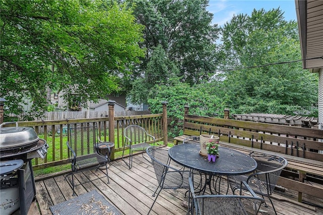 1422 S Kiowa Dr, Olathe, KS 66062 - wooden terrace with grilling area and outdoor dining area