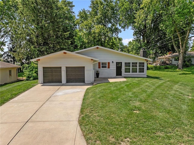 811 NW Maynard St, Blue Springs, MO 64015 - view of front facade featuring driveway, a front lawn, a chimney, and a garage