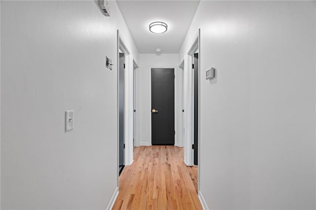 811 NW Maynard St, Blue Springs, MO 64015 - hall featuring light wood-style floors and baseboards