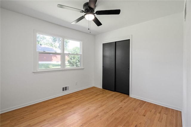 811 NW Maynard St, Blue Springs, MO 64015 - unfurnished bedroom featuring light wood-style floors, a closet, and a ceiling fan