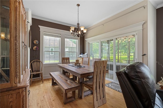 4148 SE Paddock Dr, Lees Summit, MO 64082 - dining space with crown molding, a chandelier, and light wood finished floors