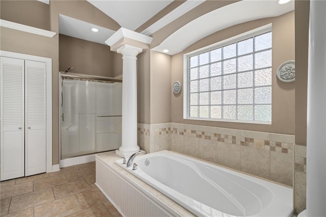 4148 SE Paddock Dr, Lees Summit, MO 64082 - bathroom featuring ornate columns, a closet, a garden tub, plenty of natural light, and lofted ceiling