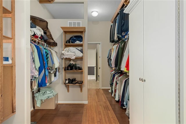 4148 SE Paddock Dr, Lees Summit, MO 64082 - spacious closet featuring wood finished floors
