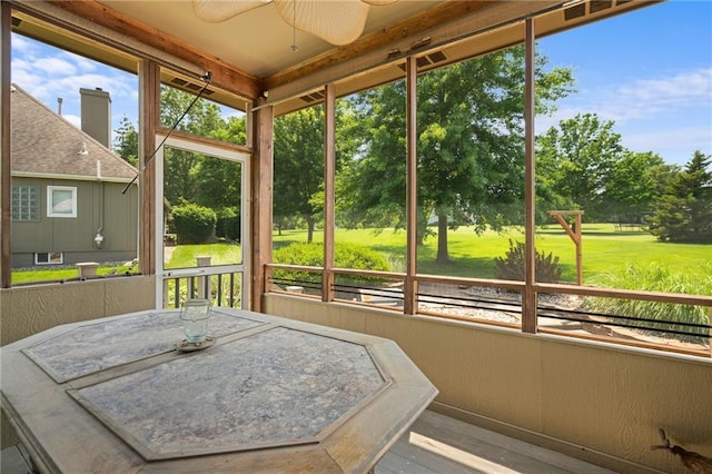 4148 SE Paddock Dr, Lees Summit, MO 64082 - sunroom featuring ceiling fan and view of scattered trees