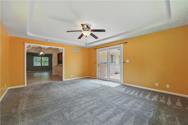 304 SE Moore St, Blue Springs, MO 64014 - carpeted empty room featuring a raised ceiling and a ceiling fan