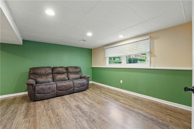304 SE Moore St, Blue Springs, MO 64014 - living area with wood finished floors, a drop ceiling, and recessed lighting