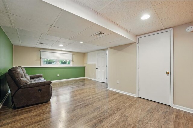 304 SE Moore St, Blue Springs, MO 64014 - living area with a drop ceiling, wood finished floors, and recessed lighting