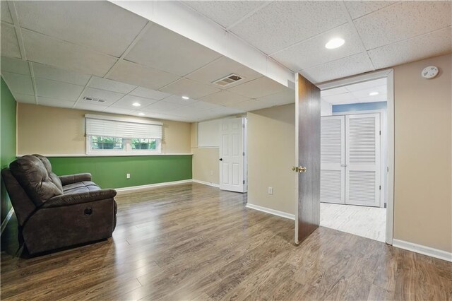 304 SE Moore St, Blue Springs, MO 64014 - living area featuring a drop ceiling, wood finished floors, and recessed lighting
