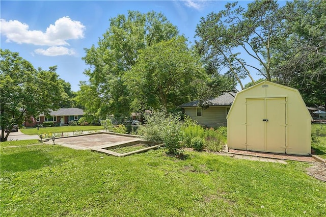 304 SE Moore St, Blue Springs, MO 64014 - view of grassy yard featuring a storage shed