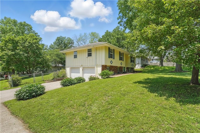 304 SE Moore St, Blue Springs, MO 64014 - view of home's exterior with board and batten siding, an attached garage, and driveway