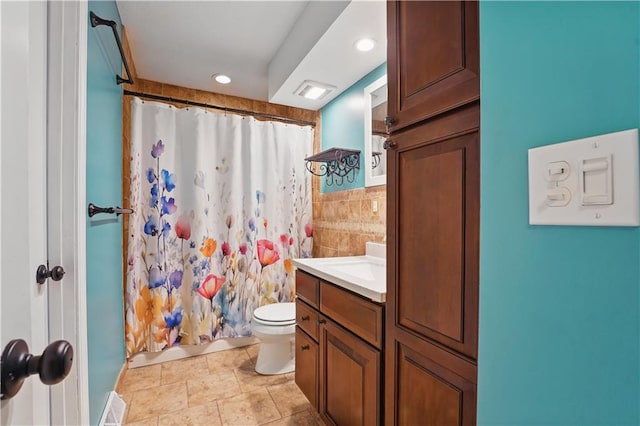 304 SE Moore St, Blue Springs, MO 64014 - full bathroom featuring vanity, recessed lighting, curtained shower, and tile walls