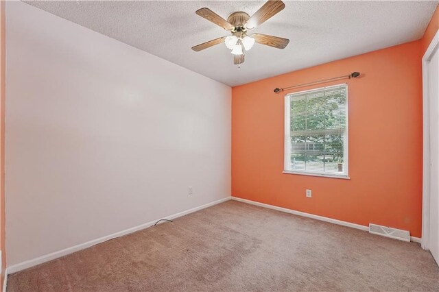 304 SE Moore St, Blue Springs, MO 64014 - carpeted empty room featuring ceiling fan and a textured ceiling