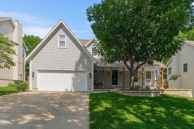 7807 Twilight Ln, Lenexa, KS 66217 - traditional-style house with a porch, a front yard, a garage, and driveway