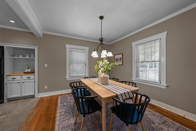 6424 Floyd St, Overland Park, KS 66202 - dining space featuring crown molding, wood finished floors, and a chandelier