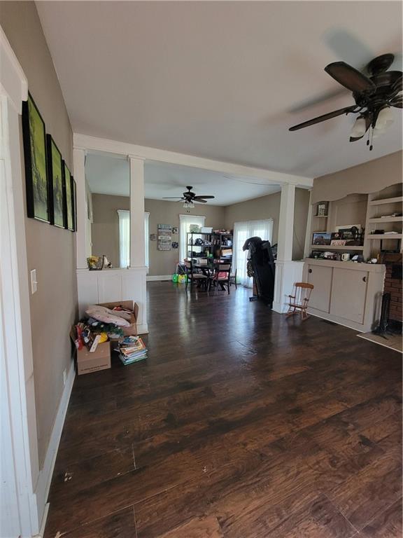 514 E Jackson Ave, Iola, KS 66749 - living room with ceiling fan and wood finished floors