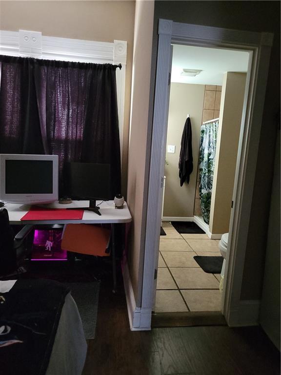 514 E Jackson Ave, Iola, KS 66749 - office area featuring baseboards and tile patterned floors