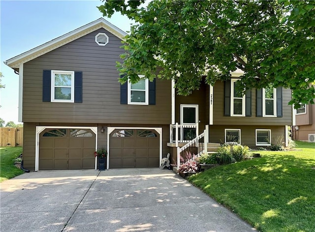 2541 NE Dale Hunter Ln, Lees Summit, MO 64086 - bi-level home featuring a garage and concrete driveway
