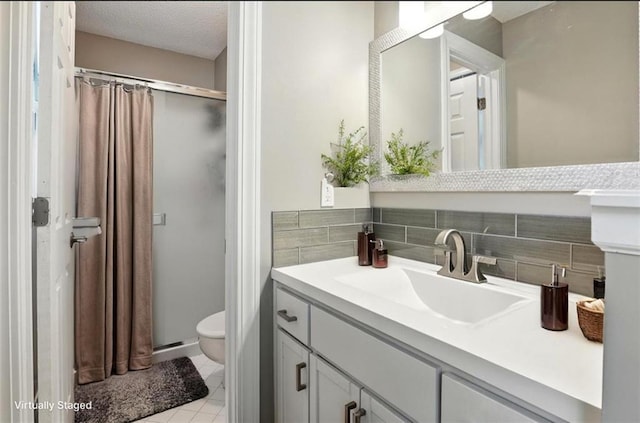 2541 NE Dale Hunter Ln, Lees Summit, MO 64086 - full bath with a stall shower, vanity, tile patterned flooring, and a textured ceiling