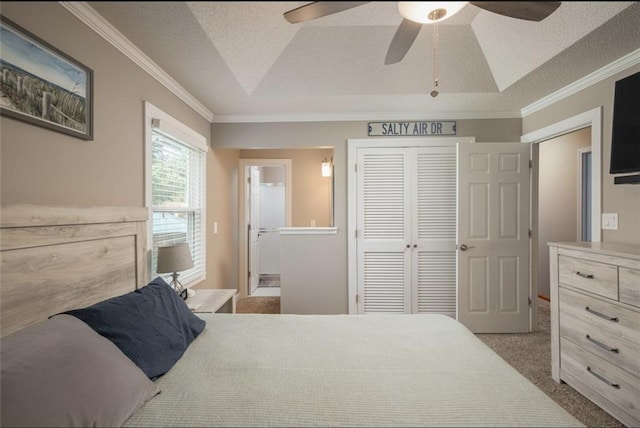2541 NE Dale Hunter Ln, Lees Summit, MO 64086 - carpeted bedroom with a raised ceiling, a closet, ornamental molding, ensuite bath, and a ceiling fan