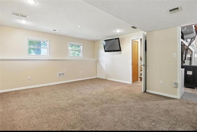 2541 NE Dale Hunter Ln, Lees Summit, MO 64086 - below grade area featuring a textured ceiling, carpet floors, and recessed lighting