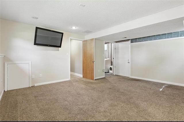 2541 NE Dale Hunter Ln, Lees Summit, MO 64086 - finished below grade area featuring carpet, a textured ceiling, and recessed lighting
