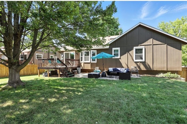 2541 NE Dale Hunter Ln, Lees Summit, MO 64086 - rear view of property with an outdoor hangout area, a wooden deck, and a patio area