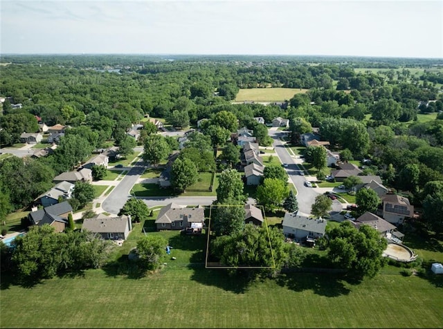 2541 NE Dale Hunter Ln, Lees Summit, MO 64086 - aerial view of residential area featuring a forest