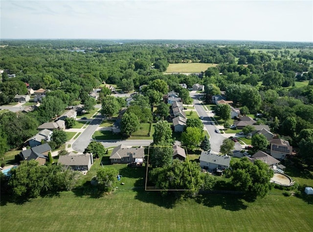 2541 NE Dale Hunter Ln, Lees Summit, MO 64086 - aerial view of residential area featuring a heavily wooded area