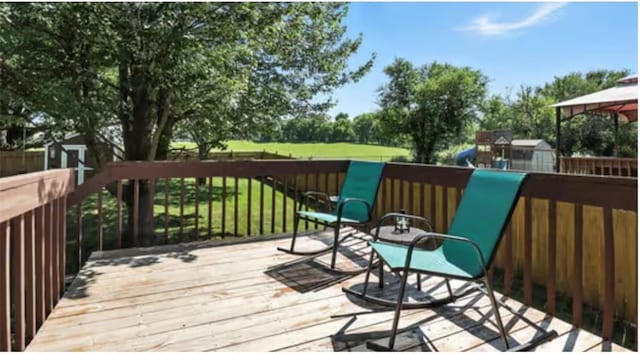 2541 NE Dale Hunter Ln, Lees Summit, MO 64086 - wooden deck featuring a gazebo and a yard