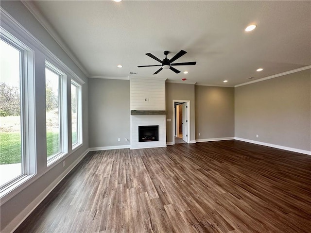11805 E Ridgeview Ct, Peculiar, MO 64078 - unfurnished living room with ornamental molding, dark wood-type flooring, a fireplace, recessed lighting, and a ceiling fan