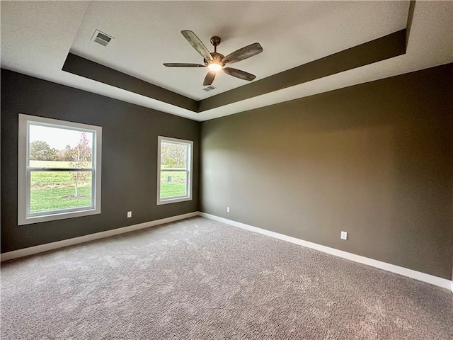 11805 E Ridgeview Ct, Peculiar, MO 64078 - carpeted empty room featuring a raised ceiling and ceiling fan