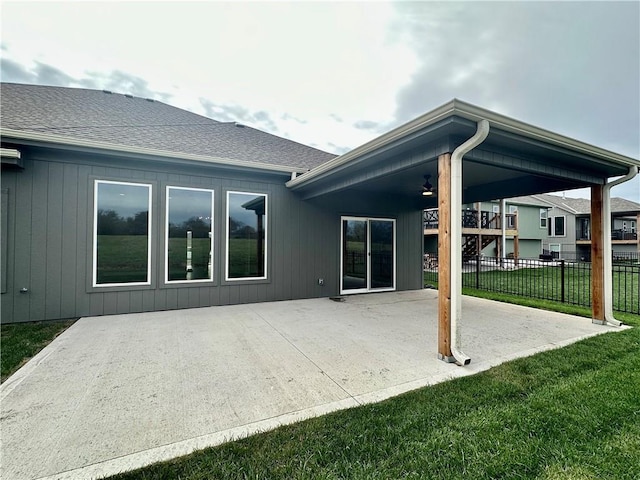 11805 E Ridgeview Ct, Peculiar, MO 64078 - rear view of house with a patio area, a ceiling fan, and a shingled roof