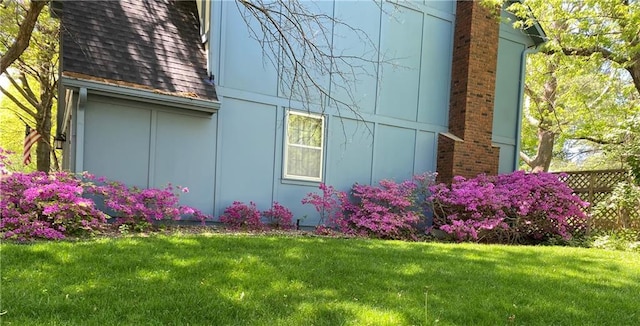 13220 W 76th St, Lenexa, KS 66216 - view of side of home featuring a chimney