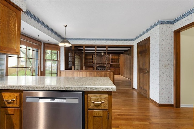 13220 W 76th St, Lenexa, KS 66216 - kitchen featuring dishwasher, wallpapered walls, wood finished floors, light countertops, and crown molding