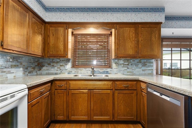13220 W 76th St, Lenexa, KS 66216 - kitchen featuring stainless steel dishwasher, wallpapered walls, brown cabinets, tasteful backsplash, and white range with electric stovetop