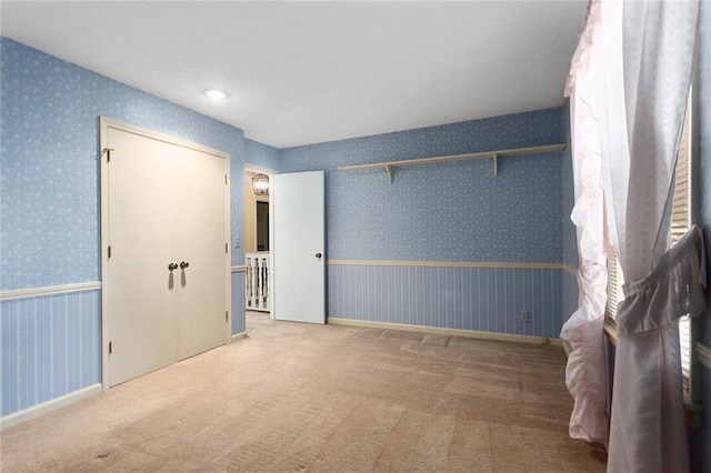 13220 W 76th St, Lenexa, KS 66216 - unfurnished bedroom with wallpapered walls and carpet floors