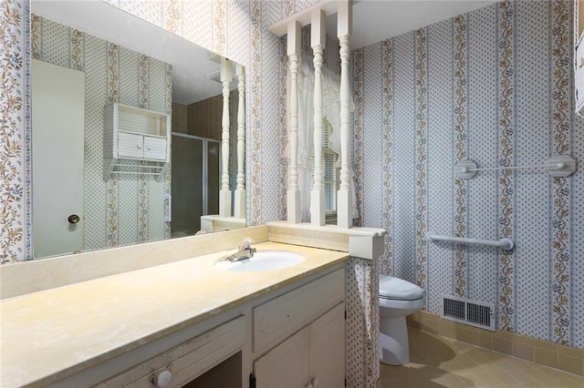 13220 W 76th St, Lenexa, KS 66216 - bathroom with wallpapered walls, vanity, a stall shower, and tile patterned floors